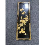 A Chinese black lacquered embossed wall plaque