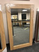 An oak effect flat framed mirror