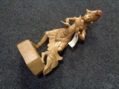 A carved wooden figure - Eastern dancer