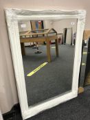 A contemporary white swept frame mirror 75 cm x 106 cm