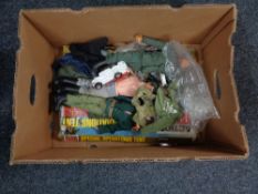 A box of Action men clothing,