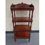 A reproduction mahogany four tier what not stand
