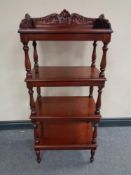 A reproduction mahogany four tier what not stand