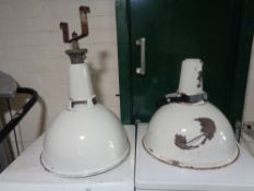 A pair of enamelled industrial light shades