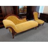 A late Victorian mahogany framed chaise and lady's chair in yellow button dralon