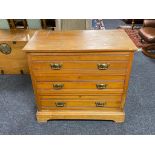 An Edwardian satinwood three drawer chest