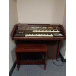 An electric GEM organ with stool