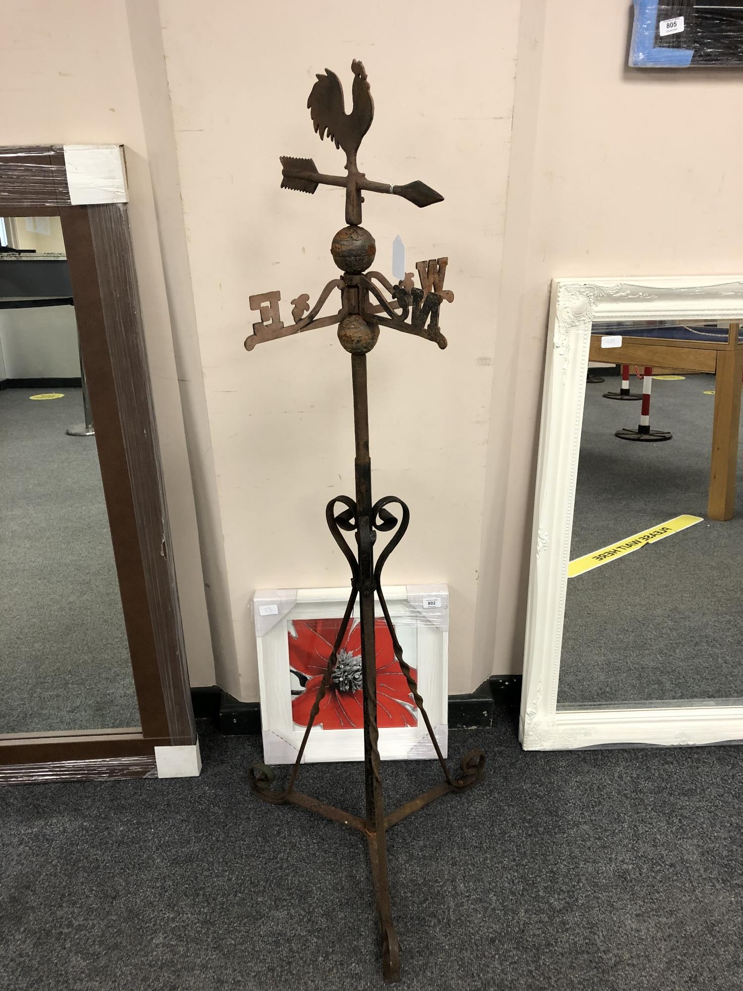 A wrought iron weather vane