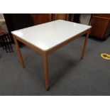A mid 20th century Formica topped kitchen table and four chairs