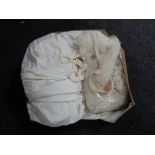 A vintage wedding dress and veil in box