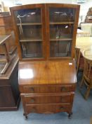 A 1930's walnut bureau bookcase