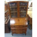 A 1930's walnut bureau bookcase