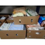 Four boxes of bedding, linen,