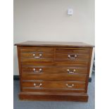 An Edwardian four drawer chest with drop handles