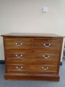 An Edwardian four drawer chest with drop handles