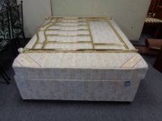 A Cumsilux orthopedic 4'6 storage divan and interior + brass headboard