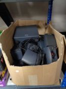 A box of assorted surround sound speakers