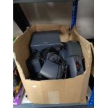 A box of assorted surround sound speakers