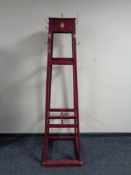 An early 20th century painted hat and coat stand