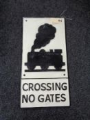 A metal Railway Crossing plaque