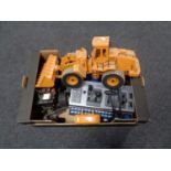 A box containing remote-control handsets, auto break control unit, remote-controlled Jeep,