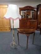 A mahogany d-shaped hall table and a gilt and onyx standard lamp