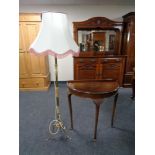 A mahogany d-shaped hall table and a gilt and onyx standard lamp