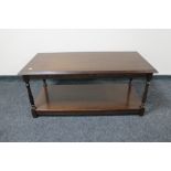 A rectangular oak coffee table with undershelf