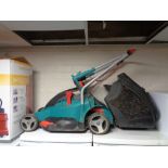 A Bosch Rotak 430 Ergoflex electric lawn mower with grass box