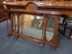 An antique mahogany overmantel mirror