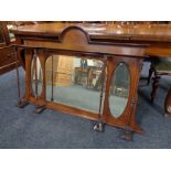 An antique mahogany overmantel mirror