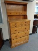 A mahogany wardrobe centre piece fitted with shelf and wooden drawers