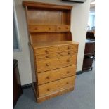 A mahogany wardrobe centre piece fitted with shelf and wooden drawers