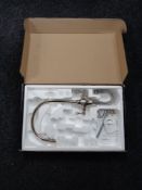 A boxed Perrin and Rowe kitchen mixer tap