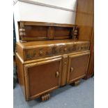 A carved oak buffet back sideboard