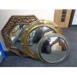 An octagonal brass framed mirror together with a circular framed brass porthole mirror and chrome