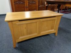 A contemporary oak blanket box