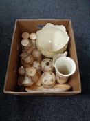 A box of Devon ware, china trinket sets, vases,