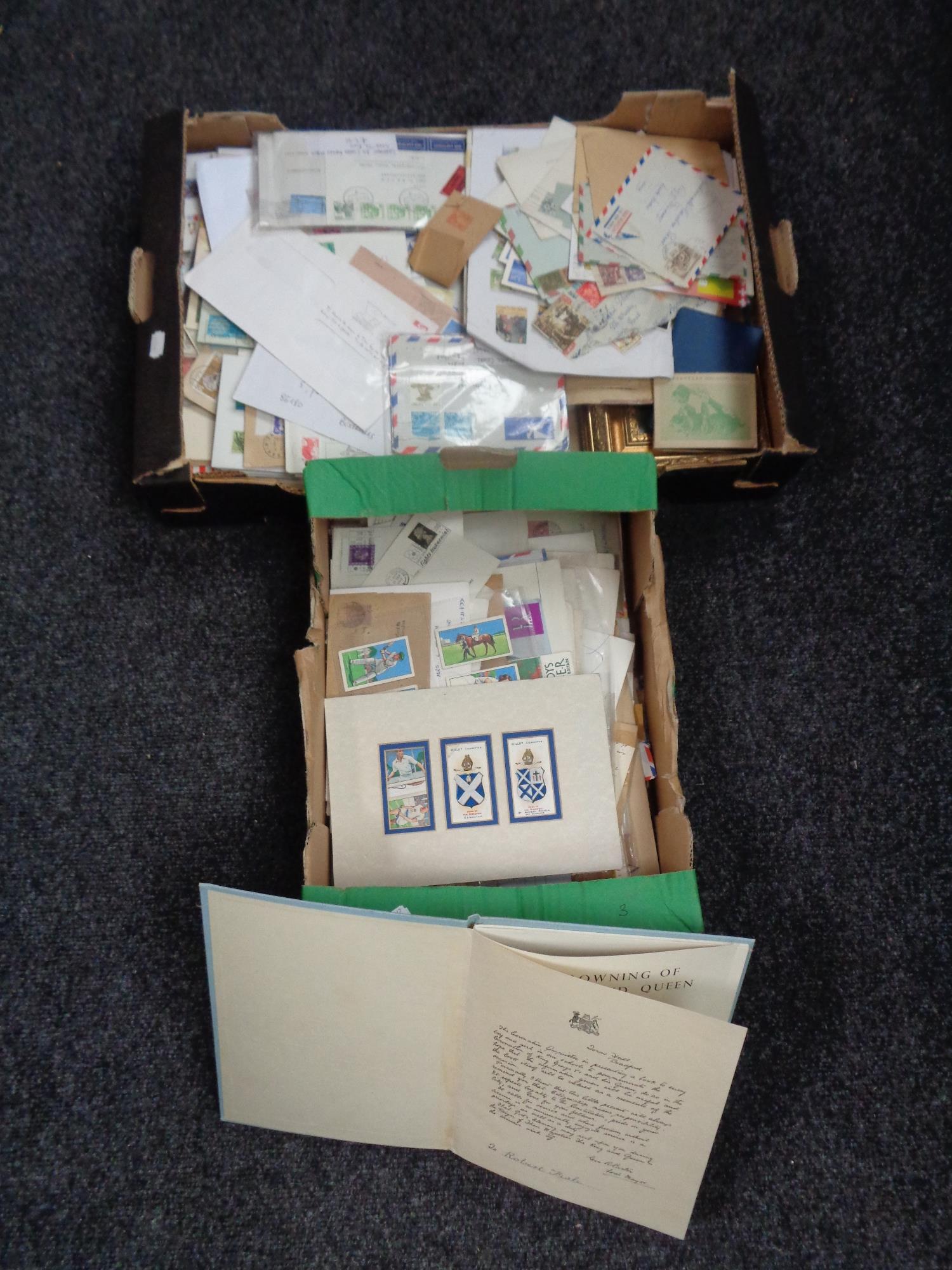 Two boxes of assorted loose stamps,