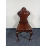 A 19th century style mahogany hall chair