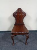 A 19th century style mahogany hall chair