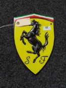 A metal Ferrari plaque