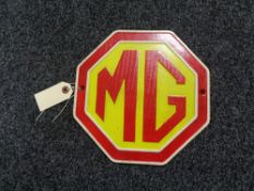 A metal MG plaque