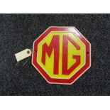 A metal MG plaque