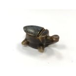 A vintage carved horn snuff box in the form of a turtle