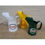 Three oil jugs - Esso,