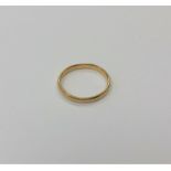 An 18ct gold band ring (misshapen) CONDITION REPORT: 2.