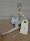 A Lladro figure - seated Ballerina