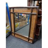 A bamboo and bergere framed mirror