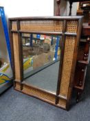 A bamboo and bergere framed mirror